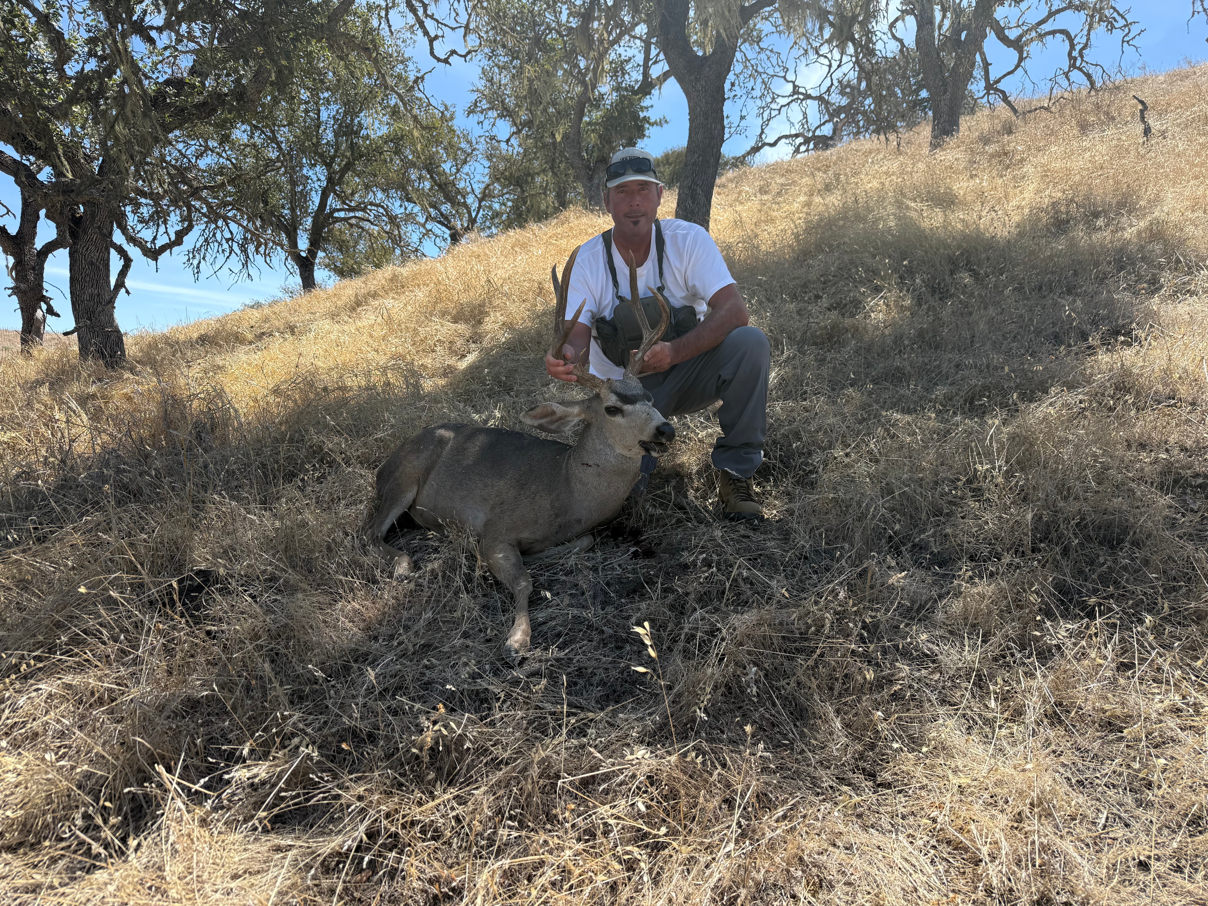 Jason with harvested mule deer buck, 2026 Deer Season at Hog Canyon Hunts